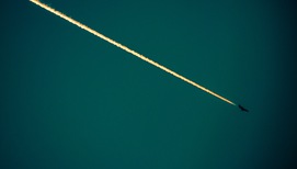 Contrail and a plane
