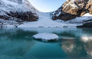 Lonely island on glacier lake